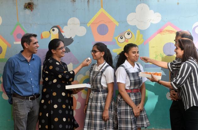 (Left) Juhi Kajaria, all-India topper from Jamnabai Narsee School in Juhu, with her parents; Forum Sanjanwala from the same school, who got all-India rank two, with her family members (right). (Satyabrata Tripathy/HT Photo) (Left) Juhi Kajaria, all-India topper from Jamnabai Narsee School in Juhu, with her parents; Forum Sanjanwala from the same school, who got all-India rank two, with her family members (right). (Satyabrata Tripathy/HT Photo)
