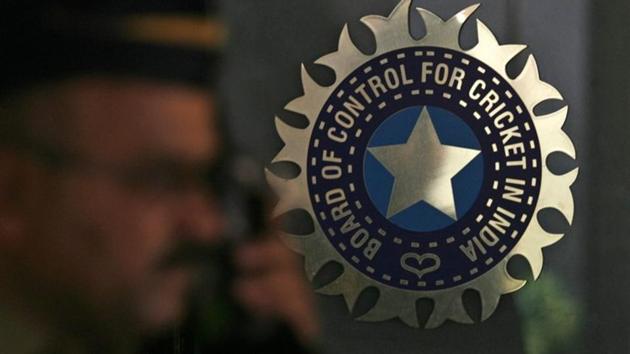 A policeman walks past a logo of the Board of Control for Cricket in India (BCCI) at BCCI headquarters in Mumbai April 26, 2010.(REUTERS)