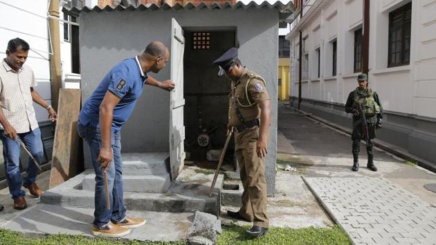 Sri Lankan police officers search a school with the help of parents in Colombo. “I have decided not to send my son to school until the country returns to normal,” said Sujeeva Dissanayake, whose son goes to the state-run Asoka College in Colombo. She and other parents were at the school to help provide security. (Eranga Jayawardena / AP) Sri Lankan police officers search a school with the help of parents in Colombo. “I have decided not to send my son to school until the country returns to normal,” said Sujeeva Dissanayake, whose son goes to the state-run Asoka College in Colombo. She and other parents were at the school to help provide security. (Eranga Jayawardena / AP)