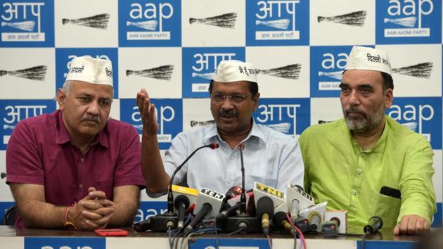 Aam Admi Party’s Arvind Kejriwal (C) with Manish Sisodia (L) and Gopal Rai at party headquarters in New Delhi. “She (Priyanka) is wasting her time in the national capital, why doesn’t she campaign in Rajasthan and Madhya Pradesh? ... Both the brother and sister aren’t going to those places where there’s direct fight with the BJP,” Kejriwal said. (Mohd Zakir / HT Photo) 