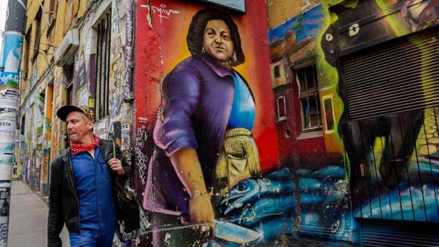 A man walks past street murals. Some 300 graffiti artists, Chileans and foreigners, have displayed their artwork on Valparaiso’s walls during the last five years, according to 34-year-old Alvaro Ramirez, a graffiti artist and businessman. “At first, most people looked at it as a scar on the city. ‘How are you going to show the city’s stains to the tourists?’ they asked me,” said Ramirez. (Martin Bernetti / AFP) A man walks past street murals. Some 300 graffiti artists, Chileans and foreigners, have displayed their artwork on Valparaiso’s walls during the last five years, according to 34-year-old Alvaro Ramirez, a graffiti artist and businessman. “At first, most people looked at it as a scar on the city. ‘How are you going to show the city’s stains to the tourists?’ they asked me,” said Ramirez. (Martin Bernetti / AFP)