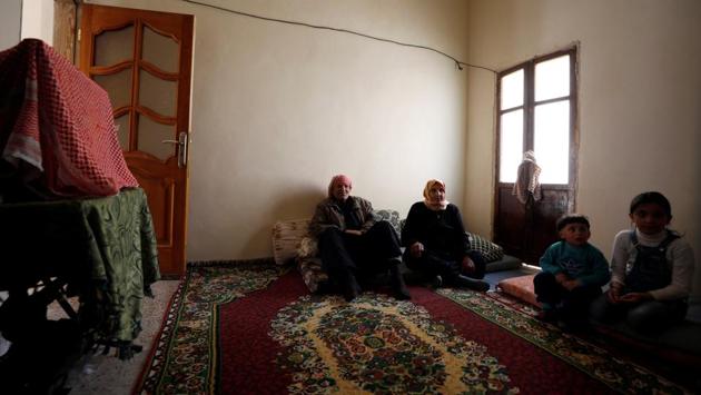 He fled the area at the start of the fighting in 2012 and returned years later when it ended with a government victory, finding his house badly damaged. The 75-year-old and his wife, Aisha, 60, borrowed money to fix the shell-smashed back wall and replaster the inside, where they now live with their daughter Maryam, 30, and her three children. (Omar Sanadiki / REUTERS) He fled the area at the start of the fighting in 2012 and returned years later when it ended with a government victory, finding his house badly damaged. The 75-year-old and his wife, Aisha, 60, borrowed money to fix the shell-smashed back wall and replaster the inside, where they now live with their daughter Maryam, 30, and her three children. (Omar Sanadiki / REUTERS)