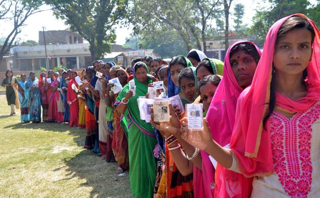 Muzaffarpur-May.6,2019- Voters in a queue with their voter ID cards as they wait in a queue to cast vote at a polling station, during the fifth phase of Lok Sabha elections in Muzaffarpur Bihar India on Monday,May 6,2019.(Photo by Santosh Kumar/Hindustan Times).