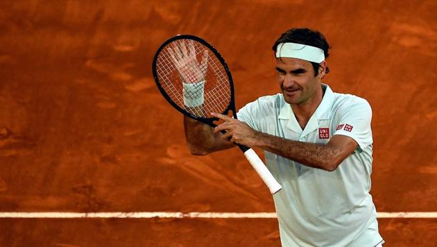 Switzerland's Roger Federer celebrates after winning a ATP Madrid Open round of 64 tennis match against France's Richard Gasquet at the Caja Magica in Madrid on May 7, 2019(AFP)
