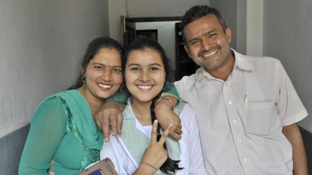 Ritika, a student of BCM Senior Secondary School, Focal Point, celebrating her success with her parents, after Class 10th results of Punjab School Education Board (PSEB) were out in Ludhiana (Photo by Gurminder Singh/Hindustan Times) Ritika, a student of BCM Senior Secondary School, Focal Point, celebrating her success with her parents, after Class 10th results of Punjab School Education Board (PSEB) were out in Ludhiana (Photo by Gurminder Singh/Hindustan Times)