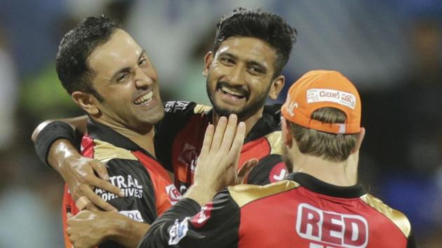 Sunrisers Hyderabad's Mohammad Nabi, left, and Khaleel Ahmed, center, celebrate after the fall of a wicket.(AP)