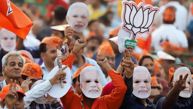 Supporters of the Bharatiya Janata Party (BJP) wear masks in the likeness PM Modi during a rally in New Delhi, on Wednesday, May 8, 2019.(Bloomberg)