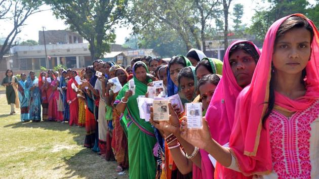 Muzaffarpur-May.6,2019- Voters in a queue with their voter ID cards as they wait in a queue to cast vote at a polling station, during the fifth phase of Lok Sabha elections in Muzaffarpur Bihar India on Monday,May 6,2019.(Photo by Santosh Kumar/Hindustan Times).