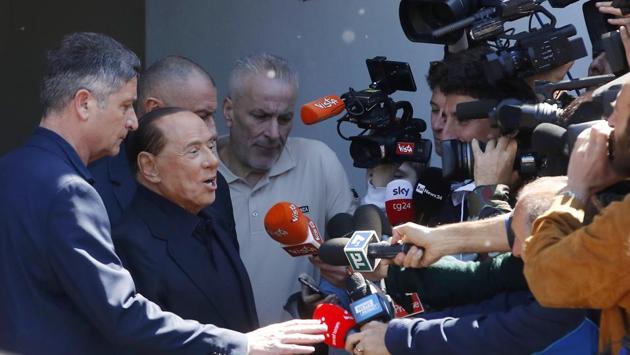 Former Italian Premier Silvio Berlusconi speaks to reporters as he leaves the San Raffaele hospital, in Milan, Italy. Berlusconi himself is running for European Parliament elections, the first time he has been allowed to run for public office following a ban imposed after a 2012 tax fraud conviction. (Antonio Calanni / AP) Former Italian Premier Silvio Berlusconi speaks to reporters as he leaves the San Raffaele hospital, in Milan, Italy. Berlusconi himself is running for European Parliament elections, the first time he has been allowed to run for public office following a ban imposed after a 2012 tax fraud conviction. (Antonio Calanni / AP)