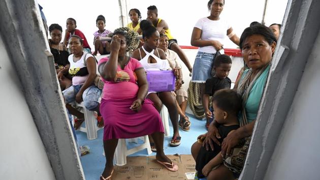People line up, waiting their turn to be seen by the doctors and nurses. Some have their hands on their stomachs, some are bent over with age, some are young pregnant women with kids in tow -- all wait to tell their woes and receive free treatment. “Some of these people have not been able to see a doctor for years,” said Ana Lucia Lopez, 51, co-founder of the Monte Tabor Foundation, which operates this 80-foot hospital. (Raul Arboleda / AFP) 