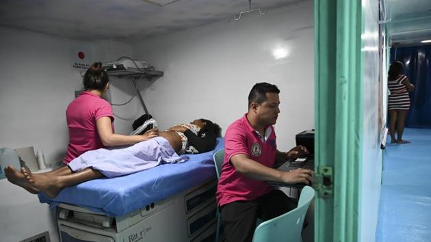 At the end of the corridor, in a small pastel-coloured room, Maria Isabel Lozano examines Carderas’ baby and diagnoses a skin infection. It’s a common diagnosis here, where communities are exposed to the polluted waters of the San Juan. The pollution is caused by chemical waste from cocaine production and run-off water from illegal mining. (Raul Arboleda / AFP) 