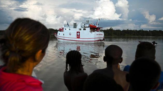 The San Raffaele is a small white speck on an ocean of despair, bringing with it specialist doctors and nurses on 12-day missions every second month. ”There are many projects, huge dreams,” says Posso. One of them is to bring a bigger and better equipped ship from the United States, given to them by entrepreneurs, it already has a name: “Archangel.” (Raul Arboleda / AFP) 