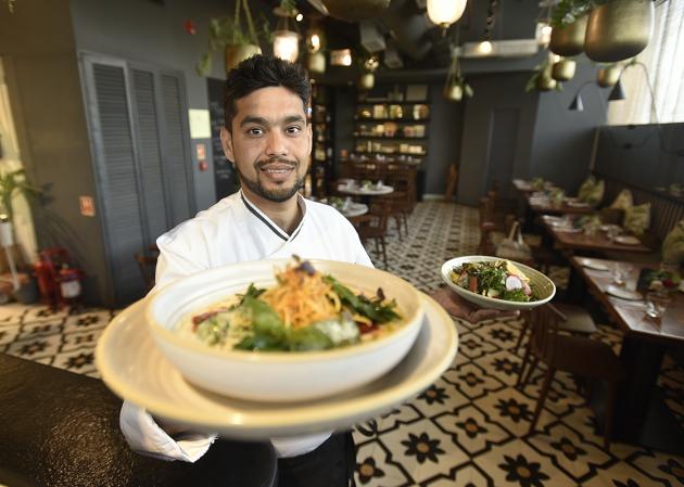 Chef Lokesh Swami holds up a plated dish of Baked Ricotta Gnocchi made from local produce at the restaurant NicoCaara in New Delhi.(Raj K Raj/HT PHOTO) Chef Lokesh Swami holds up a plated dish of Baked Ricotta Gnocchi made from local produce at the restaurant NicoCaara in New Delhi.(Raj K Raj/HT PHOTO)