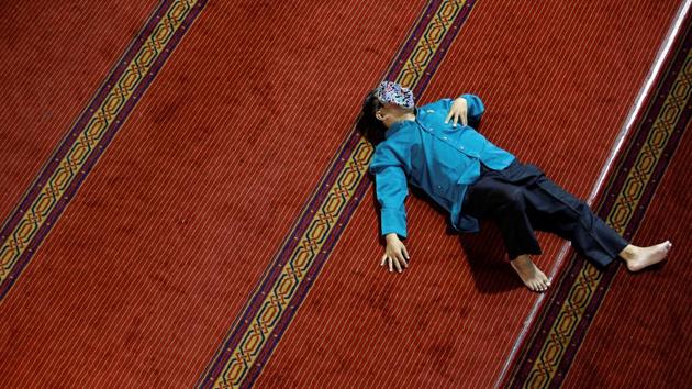A man takes a rest as he waits for iftar, the breaking of the fast, during the holy month of Ramadan at Istiqlal mosque in Jakarta, Indonesia. (Willy Kurniawan / REUTERS) A man takes a rest as he waits for iftar, the breaking of the fast, during the holy month of Ramadan at Istiqlal mosque in Jakarta, Indonesia. (Willy Kurniawan / REUTERS)