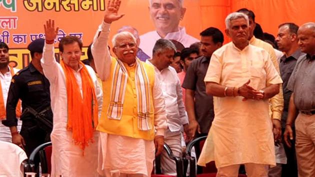 Chief minister ML Khattar with other BJP leaders during a poll meeting at Sampla town in Rohtak on Thursday. Chief minister ML Khattar with other BJP leaders during a poll meeting at Sampla town in Rohtak on Thursday.