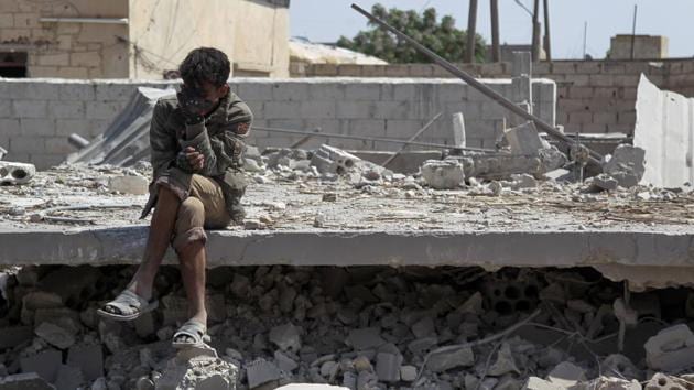 A man sits amid the rubble of a building, destroyed during airstrikes by the Syrian regime and their allies near the town of Saraqeb in Syria’s rebel-held northwestern province of Idlib. (Amer Alhamwe / AFP) A man sits amid the rubble of a building, destroyed during airstrikes by the Syrian regime and their allies near the town of Saraqeb in Syria’s rebel-held northwestern province of Idlib. (Amer Alhamwe / AFP)