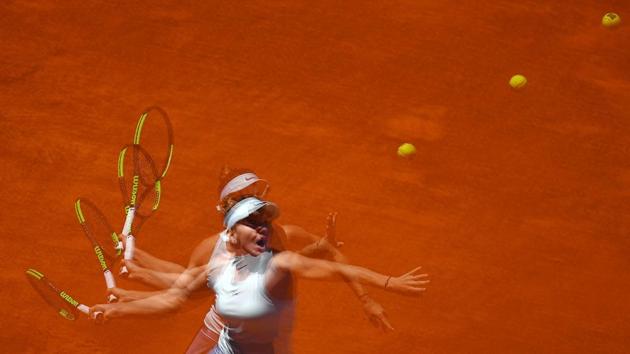 A multiexposure picture shows Romania’s Simona Halep returning the ball to Australia’s Ashleigh Barty during their WTA Madrid Open round of 8 tennis match at the Caja Magica in Madrid. Spain. (Gabriel Buoys / AFP) A multiexposure picture shows Romania’s Simona Halep returning the ball to Australia’s Ashleigh Barty during their WTA Madrid Open round of 8 tennis match at the Caja Magica in Madrid. Spain. (Gabriel Buoys / AFP)