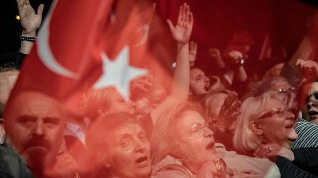 Supporters of Istanbul Mayor Ekrem Imamoglu react as they wait for him during a protest against the re-run of Istanbul mayoral election in Istanbul, Turkey. (Bulent Kilic / AFP) Supporters of Istanbul Mayor Ekrem Imamoglu react as they wait for him during a protest against the re-run of Istanbul mayoral election in Istanbul, Turkey. (Bulent Kilic / AFP)