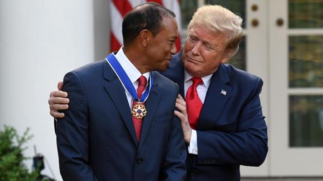US President Donald Trump presents US golfer Tiger Woods with the Presidential Medal of Freedom during a ceremony in the Rose Garden of the White House in Washington, DC. (Saul Loeb / AFP) US President Donald Trump presents US golfer Tiger Woods with the Presidential Medal of Freedom during a ceremony in the Rose Garden of the White House in Washington, DC. (Saul Loeb / AFP)