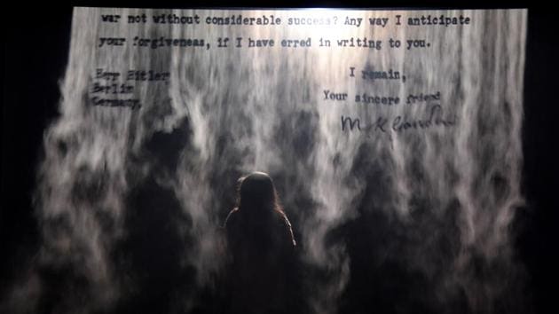 Mist is also put to effective use inside the Indian Pavilion, in a tribute to Mahatma Gandhi, marking the 150th anniversary of his birth. Artist Jitish Kallat projects a 1939 letter written by Gandhi to Adolf Hitler. Kallat said the “Dear friend” salutation projects Gandhi’s message across time “and asks the reader to rethink what they ... can do to save the world from going to a savage state.” (Tiziana Fabi / AFP)