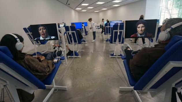 Israeli artist Aya Ben Ron has created a field hospital to treat social ills from domestic abuse to racism to occupation, which forces hurried visitors to slow down, take a number and wait their turn. Angelica Mesiti uses film to examine ways citizens can assemble and communicate against the backdrop of fragile democracy. (Andrea Merola / ANSA via AP)