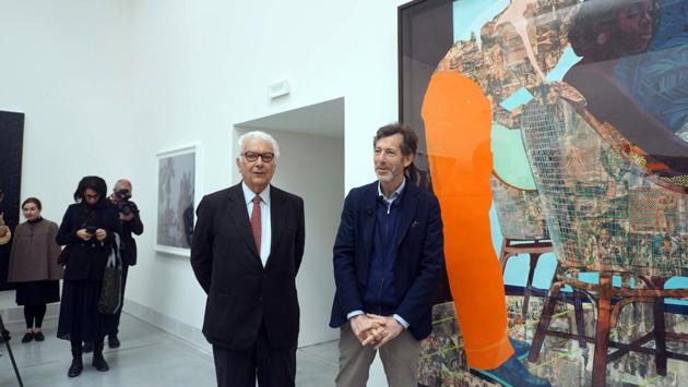 “Where do we have a space in our culture where this part of being human is given a place? It really exists in contemporary art,” Rugoff (R) said on a preview walk through the main exhibit, split between two main venues, in the leafy Giardini and the Arsenale. Many of the 79 artists invited to the main exhibition make very literal references to present-day woes. (Andrea Merola / ANSA via AP)