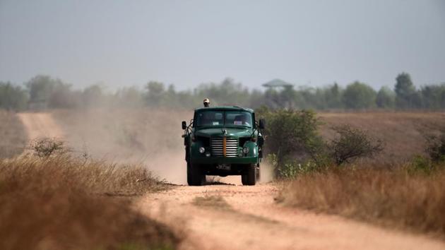 Forest rangers drive a water truck as they arrive to fill a lake in the Shwe Settaw nature reserve. The sum received is enough to pay for the petrol and fees needed to hire water-carrying tankers that make six daily trips to a small river some 15 kilometres away. Each tanker holds around 4,500 litres. (Ye Aung Thu / AFP)