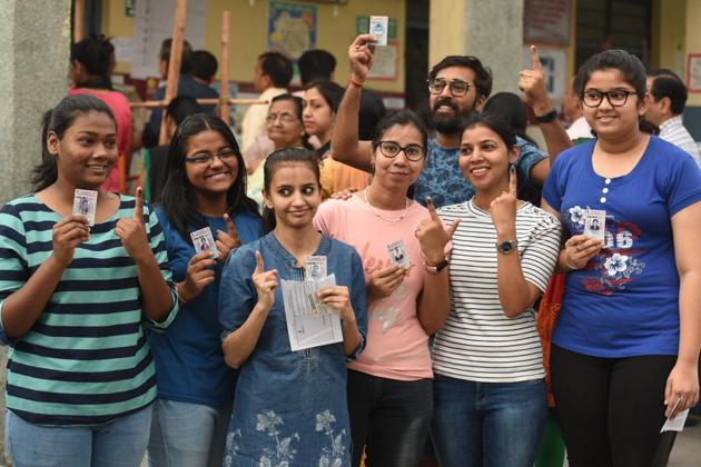 First-time voters at a polling booth in Pandav Nagar in Delhi on Sunday.(Raj K Raj/HT photo)