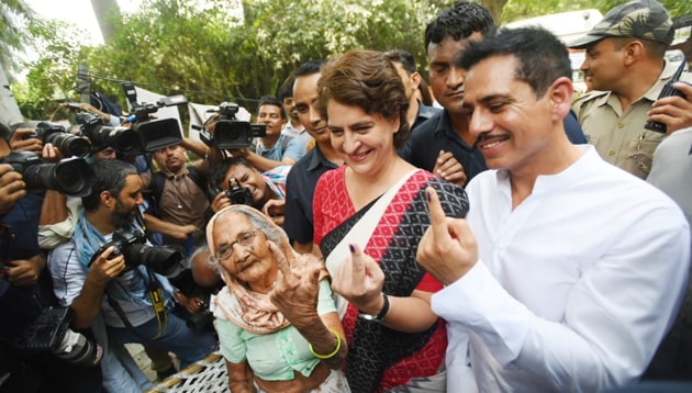 Priyanka Gandhi was accompanied by her businessman husband Robert Vadra as she came to cast her vote.(Amal KS/ HT Photo)