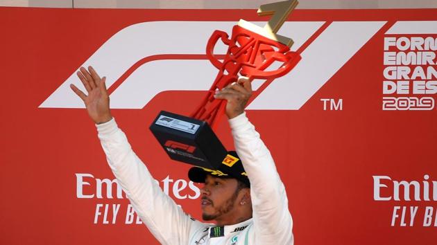 Mercedes' British driver Lewis Hamilton celebrates on the podium after winning the Spanish Formula One Grand Prix. (AFP) Mercedes' British driver Lewis Hamilton celebrates on the podium after winning the Spanish Formula One Grand Prix. (AFP)
