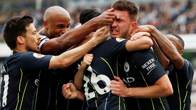 Manchester City's Aymeric Laporte celebrates scoring their second goal with Vincent Kompany and David Silva.(Action Images via Reuters)