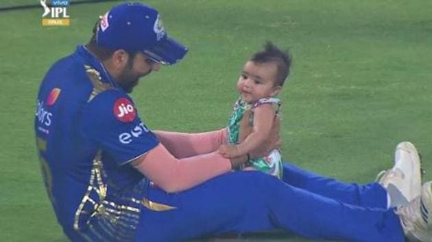 Mumbai Indians captain Rohit Sharma shares a moment with daughter Samaira after his team beat Chennai Super Kings by 1 run in Hyderabad to win the IPL 2019 title.(Twitter)