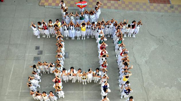 Children form a human chain as they celebrate ahead of the Mothers day on Sunday, in Moradabad. (PTI) Children form a human chain as they celebrate ahead of the Mothers day on Sunday, in Moradabad. (PTI)