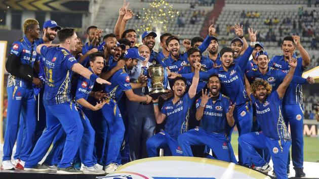 Mumbai Indians (MI) players celebrate with the IPL 2019 trophy after winning the final match against Chennai Super Kings.(PTI)