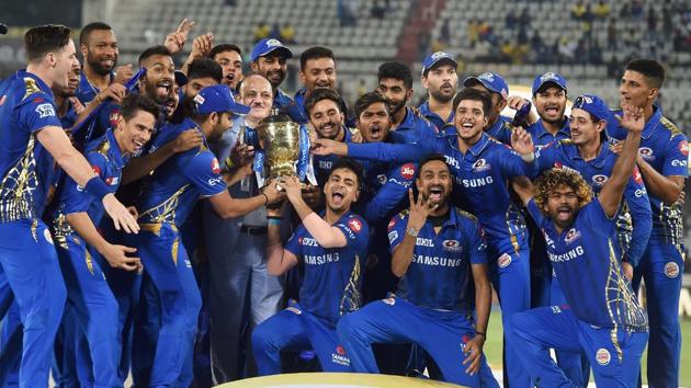 Mumbai Indians (MI) skipper Rohit Sharma with his teammates celebrating with Indian Premier League 2019 winning trophy. (PTI)