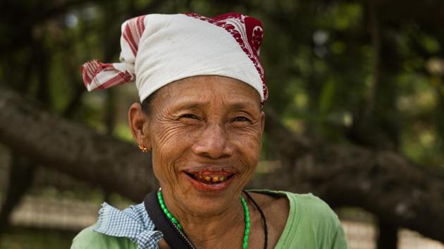 A Karbi tribal woman Among Kleng, 62, poses for a photograph at a market near Guwahati. Kleng said that no elected leaders listen to their problems but she had cast her vote in the hope of a better future. Combined, India's tribals total more than 100 million people. But they are scattered among hundreds of communities, and are often poorer and less educated than the people around them. (Anupam Nath / AP) A Karbi tribal woman Among Kleng, 62, poses for a photograph at a market near Guwahati. Kleng said that no elected leaders listen to their problems but she had cast her vote in the hope of a better future. Combined, India's tribals total more than 100 million people. But they are scattered among hundreds of communities, and are often poorer and less educated than the people around them. (Anupam Nath / AP)
