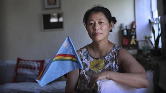 An indigenous Naga tribal woman Tungshang Ningreichon holds a Naga flag in New Delhi. Ningreichon, a longtime rights activist, said she believes the election “affects every part of our lives. The leaders that we choose would greatly impact how we put the idea of peace, justice and democracy into practice.” (Manish Swarup / AP) An indigenous Naga tribal woman Tungshang Ningreichon holds a Naga flag in New Delhi. Ningreichon, a longtime rights activist, said she believes the election “affects every part of our lives. The leaders that we choose would greatly impact how we put the idea of peace, justice and democracy into practice.” (Manish Swarup / AP)