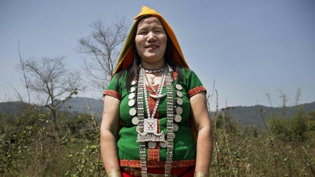 An Adi tribal woman Kargep Yao, 36, poses for a photograph in Along, in the northeastern Indian state of Arunachal Pradesh. Yao said that she will cast her vote for a better future, development and security for women. (Anupam Nath / AP) An Adi tribal woman Kargep Yao, 36, poses for a photograph in Along, in the northeastern Indian state of Arunachal Pradesh. Yao said that she will cast her vote for a better future, development and security for women. (Anupam Nath / AP)