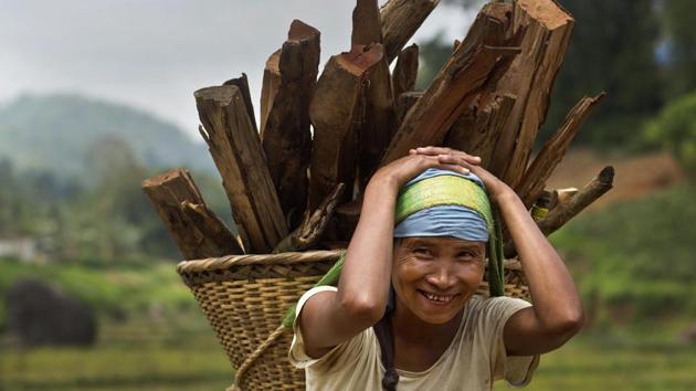 A Khasi tribal woman Lona Syngkli carries firewood in a basket swung around her head in Nongpoh, in Meghalaya state. As women, these voters already face immense hurdles in a nation where women are often relegated to second-class roles. Syngkli said she knew nothing about politics but had cast her vote because her husband told her to. (Anupam Nath / AP) A Khasi tribal woman Lona Syngkli carries firewood in a basket swung around her head in Nongpoh, in Meghalaya state. As women, these voters already face immense hurdles in a nation where women are often relegated to second-class roles. Syngkli said she knew nothing about politics but had cast her vote because her husband told her to. (Anupam Nath / AP)