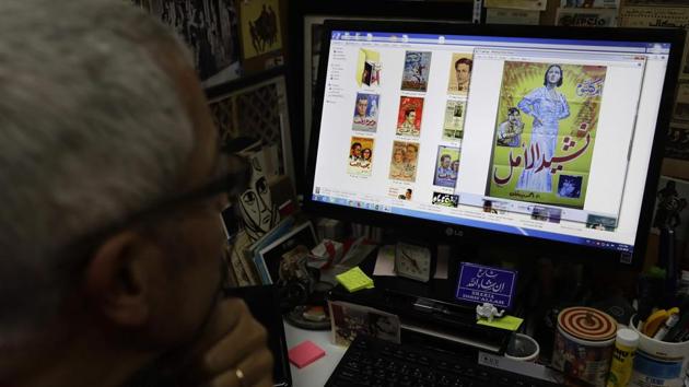 Abu Jawdeh looks through digital files of his vintage cinema poster collection at his office. They “resembled the paintings that Orientalists painted of the region in the 18th and 19th centuries,” he says. (Joseph Eid / AFP) Abu Jawdeh looks through digital files of his vintage cinema poster collection at his office. They “resembled the paintings that Orientalists painted of the region in the 18th and 19th centuries,” he says. (Joseph Eid / AFP)