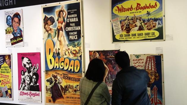 The images are on show until May 25. Rabbah Faqih, a masters student in archive management, looks at a poster featuring a skimpily dressed actress.”I’m all for a good expressive poster to draw people in, but I’m against commodifying women like this,” she says. “We’re not all belly dancers in Lebanon,” she said. (Joseph Eid / AFP) The images are on show until May 25. Rabbah Faqih, a masters student in archive management, looks at a poster featuring a skimpily dressed actress.”I’m all for a good expressive poster to draw people in, but I’m against commodifying women like this,” she says. “We’re not all belly dancers in Lebanon,” she said. (Joseph Eid / AFP)