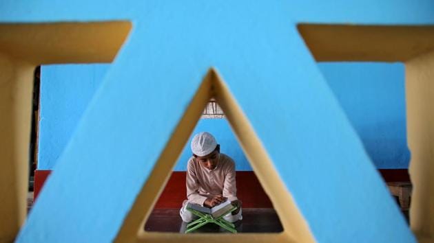 A boy reads the Quran inside a mosque on the first day of the holy fasting month of Ramadan on the outskirts of Agartala. (Jayanta Dey / REUTERS) A boy reads the Quran inside a mosque on the first day of the holy fasting month of Ramadan on the outskirts of Agartala. (Jayanta Dey / REUTERS)