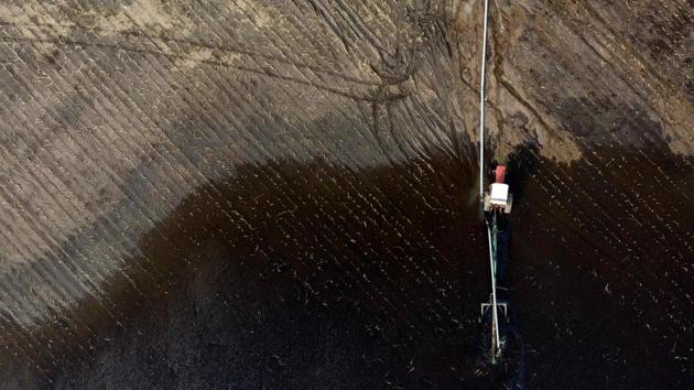 An aerial image of a tractor pumping water from a flooded field. Of Nebraska’s 93 counties, 81 have declared states of emergency, said Steve Wellman, director of the Nebraska Department of Agriculture. “So 85 percent of the state of Nebraska has been impacted by either flooding or blizzard conditions from the middle of March,” he said. (Johannes Eisele / AFP) An aerial image of a tractor pumping water from a flooded field. Of Nebraska’s 93 counties, 81 have declared states of emergency, said Steve Wellman, director of the Nebraska Department of Agriculture. “So 85 percent of the state of Nebraska has been impacted by either flooding or blizzard conditions from the middle of March,” he said. (Johannes Eisele / AFP)