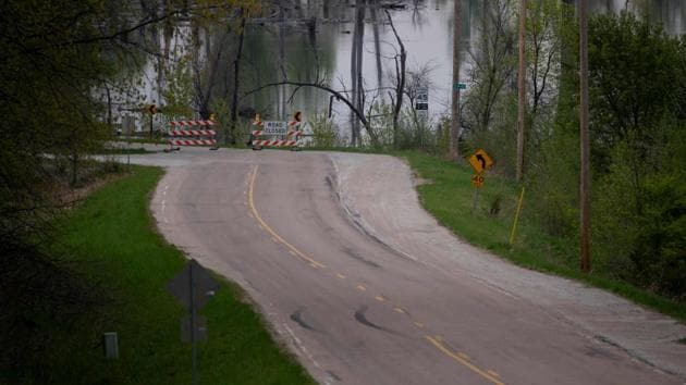 A sign reads, ‘road closed,’ near Omaha, Nebraska, as the Missouri River continues to flood, making neighbourhoods uninhabitable and cutting off public services. The floods came as farm incomes have fallen about 50 percent since 2013 due to low crop prices, leading to debt levels not seen since the 1980s. In the wake of the disaster, growers have been granted extensions on credit payments and loans, as well as the possibility in some cases to renegotiate loans at lower interest rates. (Johannes Eisele / AFP) A sign reads, ‘road closed,’ near Omaha, Nebraska, as the Missouri River continues to flood, making neighbourhoods uninhabitable and cutting off public services. The floods came as farm incomes have fallen about 50 percent since 2013 due to low crop prices, leading to debt levels not seen since the 1980s. In the wake of the disaster, growers have been granted extensions on credit payments and loans, as well as the possibility in some cases to renegotiate loans at lower interest rates. (Johannes Eisele / AFP)