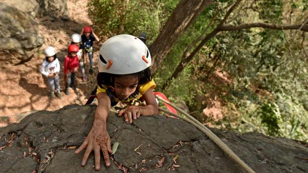 Children taking part in different type of adventurous activities such as Commander bridge,Zip-line and Rock climbing at Sanjay Ghandi National Park,Borivali in Mumbai. (Satyabrata Tripathy / HT Photo) Children taking part in different type of adventurous activities such as Commander bridge,Zip-line and Rock climbing at Sanjay Ghandi National Park,Borivali in Mumbai. (Satyabrata Tripathy / HT Photo)