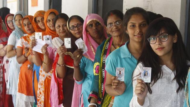 Voters wait outside a polling booth during the sixth phase of Lok Sabha elections 2019, at Badshahpur, Gurugram, on Sunday, 12 May 2019.(Yogendra Kumar/HT PHOTO)