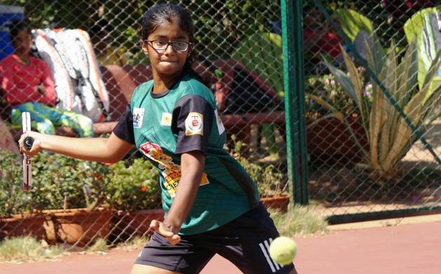 City player Aditi Lakhe in action at the MSLTA Yonex Sunrise Hotel Ravine under-14 national ranking tennis tournament at Ravine hotel courts on Tuesday.(HT PHOTO)