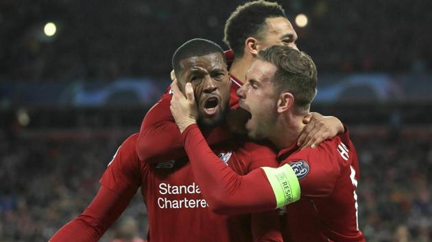 Liverpool's Georginio Wijnaldum, left, celebrates scoring his side's third goal of the game. (AP) Liverpool's Georginio Wijnaldum, left, celebrates scoring his side's third goal of the game. (AP)
