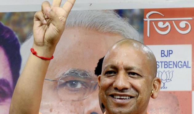 Uttar Pradesh Chief Minister Yogi Adityanath shows victory sign during a press meet in Kolkata on Wednesday.(ANI)