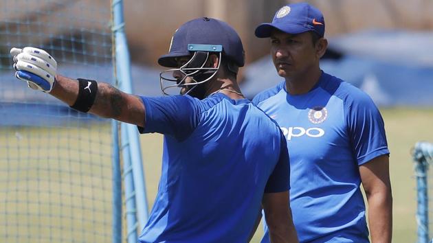 India's captain Virat Kohli, left, interacts with batting coach Sanjay Bangar during a practice session.(AP)